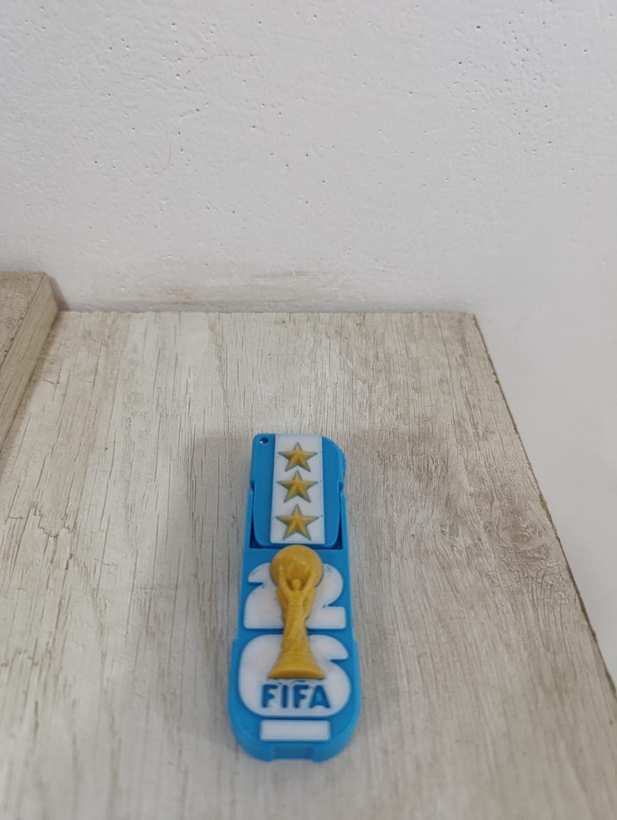 Detalle de Llavero porta celular Selección Argentina impreso en 3D